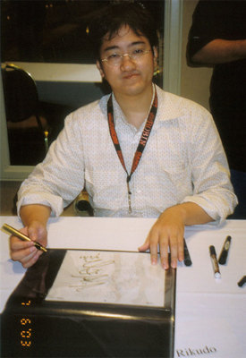 Rikudou at Anime Expo 2003 doing signings 
(source: http://www.angelfire.com/ca/jmightypages/ax2003/rikudo.jpg)
